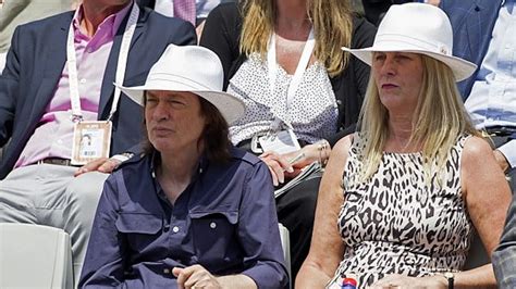 angus young and wife|Ellen Young is married to AC/DC guitarist, Angus Young .